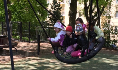 Children on large swing