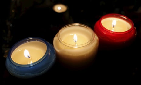 Candles in the colours of the French flag outside the Bataclan concert hall, one of the sites of the terrorist attacks in Paris on 13 November. They were lit in a ceremony to pay tribute to victims that was held on Friday, a week after the bombings and shootings.