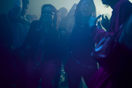 Young people dance in a club