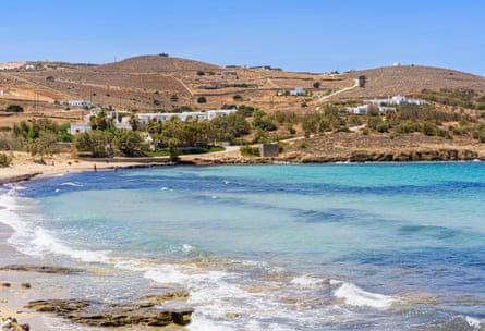 Beach and waves with low hills in Aegean