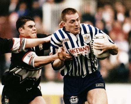 Paul Newlove of St Helens tries to evade the Workington defence at Knowsley Road in December 1995