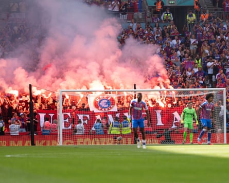 Palace fans vent through the medium of flares and signs.