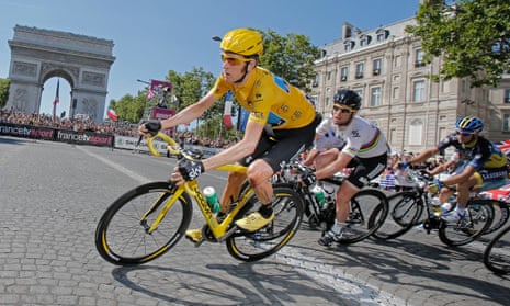 Bradley Wiggins is followed by team-mate Mark Cavendish as they pass the Arc de Triomphe in Paris in 2012