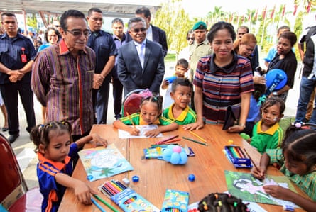 Francisco ‘Lu’Olo’ Guterres and his wife Cidalia Mozinho watch children drawing during a ceremony to mark the Children’s Day in Dili on 1 June.