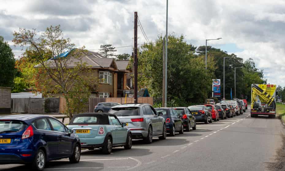 Cars queue outside a petrol station in Iver, Buckinghamshire.