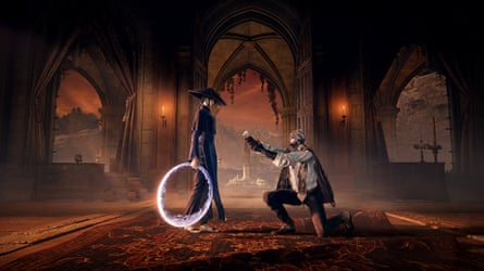 A character stands holding a large glowing ring at their side. A caped character kneels before them holding a flower up to them.