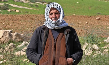 Fares Hassan wearing a headscarf in a field