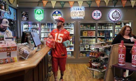 A man buys beer in preparation for the first game of the NFL season, in Kansas on September 10, 2020.