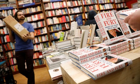 a New York bookshop employee brings in copies of Fire and Fury on Friday for its in-store display.