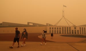 ‘Sociologist Ulrich Beck wrote that smog is the great equaliser; none of us can escape it. But smog, and smoke, do not affect us equally.’ Visitors to Parliament House in Canberra wear face masks after hazardous smoke from bushfires blankets the city.
