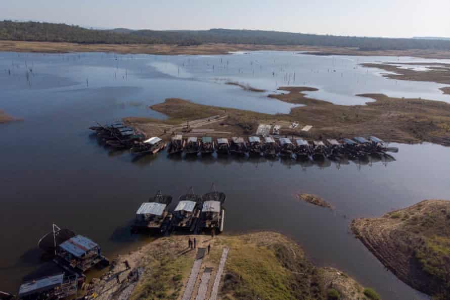 Docked boats seen from above on an inlet of the lake