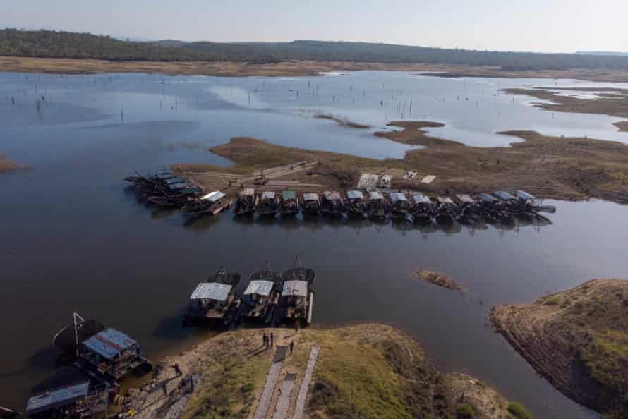 Docked boats seen from above on an inlet of the lake