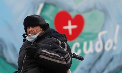 A man sits outside a health clinic near Moscow, Russia.