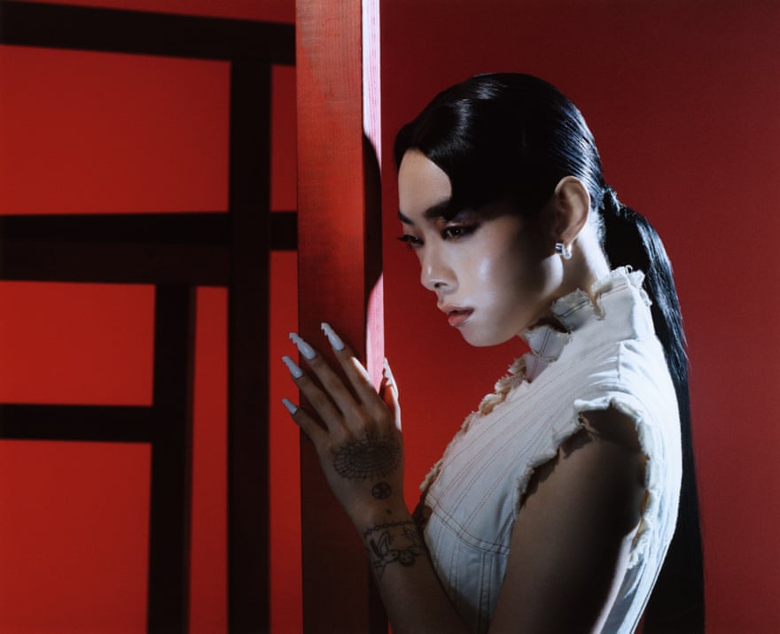 Sawayama posing on a red themed set