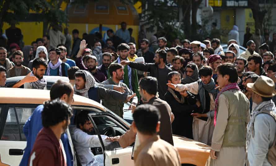 People outside a closed bank in Kabul on Saturday.
