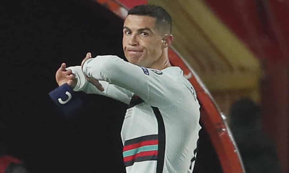 Cristiano Ronaldo holds his captain’s armband moments before throwing it to the ground and leaving the pitch in Belgrade.