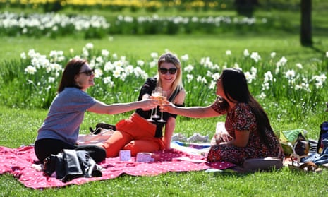 People in St James’s Park, London, enjoy the easing of lockdown restrictions on Monday.