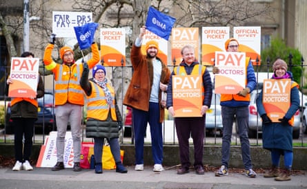 A picket statement of 7 group waving flags and holding placards