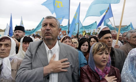 Crimean Tatars attend a memorial ceremony marking the 70th anniversary of the deportation of Tatars from Crimea, near a mosque in Simferopol, in 2014.