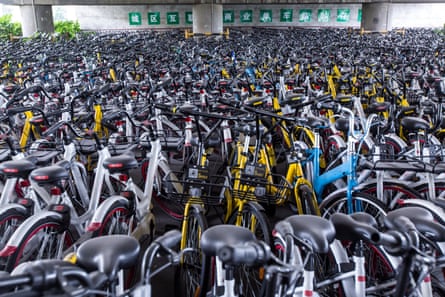 A sea of dockless share bikes beneath an overpass in Hangzhou, China.