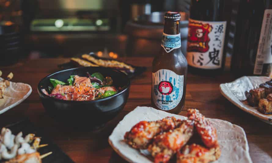 A selecton of dishes and a bottle of beer at Bincho Yakitori, Brighton.