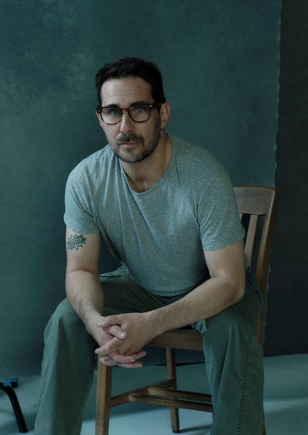 AJ Daulerio poses for a portrait in a studio