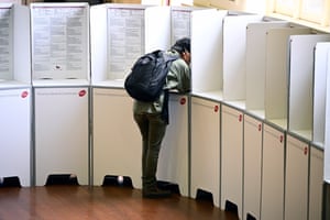 Voters complete their ballot at St Agnes church in Richmond