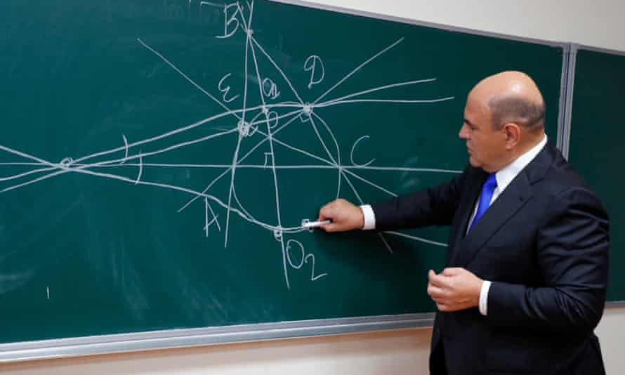 Russian Prime Minister Mikhail Mishustin visits the physics and technology lyceum in Dolgoprudnyepa09440188 Russian Prime Minister Mikhail Mishustin writes on a chalkboard during his visit the ÔKapitsaÕ physics and technology lyceum in Dolgoprudny, Moscow region, Russia, 01 September 2021. Today is the Day of Knowledge in Russia. 17 million schoolchildren will sit at their desks, of which almost two million are first-graders. There are 90 thousand more of them than last year. EPA/DMITRY ASTAKHOV / SPUTNIK / GOVERNMENT PRESS SERVICE / POOL