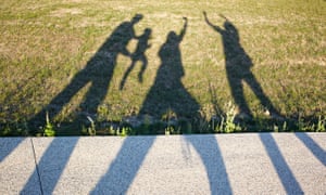 shadow on ground of family figures