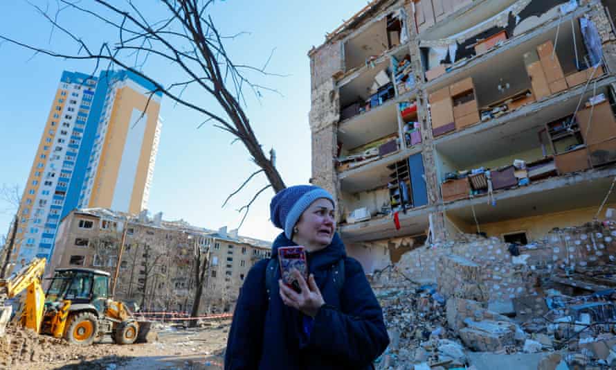 A resident outside a severely damaged 5-storey residence in Vynohradar, Kyiv, as missile strikes on the area at about 8 AM local time have been reported by local residents and media. 18 Mar 2022