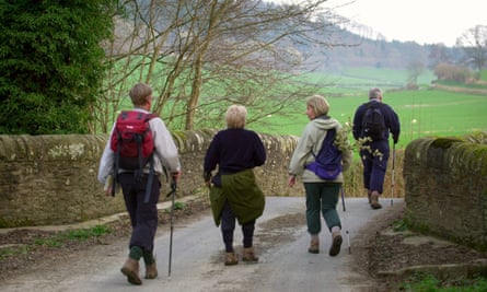 Walkers crossing the River Lugg at Lyepole Bridge, on the Mortimer Trail between Ludlow and Kington