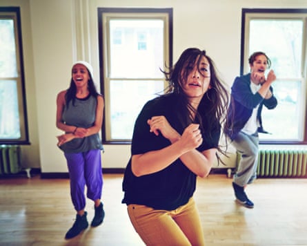 Young people dancing together in a studio