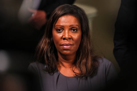 A woman stands at a press conference