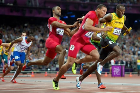 Tyson Gay hands the baton to his US teammate Ryan Bailey in the 4x100m relay final at London 2012. Gay later tested positive for anabolic steroids.