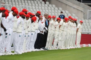 The teams line up before the start of play.