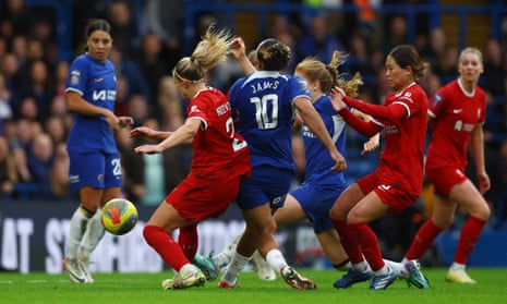 Chelsea’s Lauren James steals in amongst a bunch of Liverpool players to score their fourth goal and complete her hat-trick
