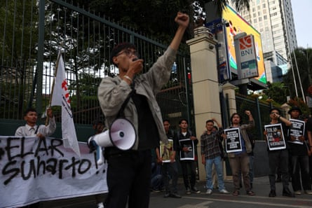Activists carrying banner and posters shout slogans during a protest against former Indonesian president Suharto, who was named a national hero, outside the ministry of culture building in Jakarta, Indonesia, 10 November, 2025.