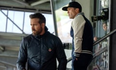This image released by FX shows Rob McElhenney, Ryan Reynolds, right, in a scene from the second season of "Welcome to Wrexham." premiering Sept. 12. (FX via AP)