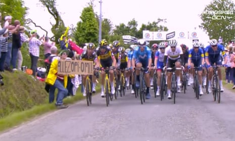 The 30-year-old French woman and the large cardboard sign that caused a mass crash during Saturday’s opening stage of this year’s Tour de France