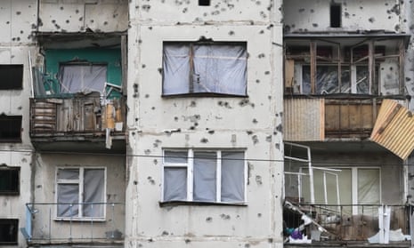Traces of shrapnel from Russian rockets mark a home in Slavyansk in eastern Ukraine’s Donetsk region