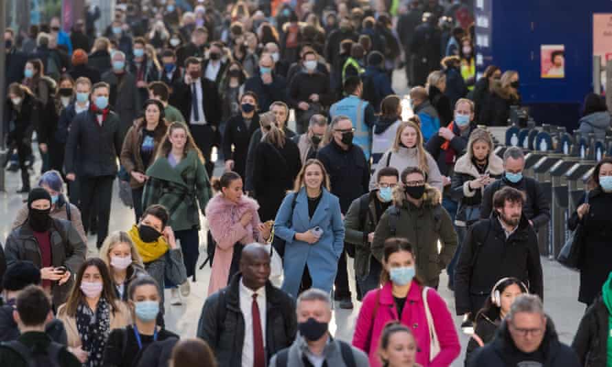 Ministers warned getting rid of free Covid tests will lead to £500 ‘caring tax’ | Coronavirus 1 Commuters at Waterloo station