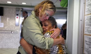 Carmen Yulín Cruz hugs a woman during her visit to an elderly home in San Juan, Puerto Rico on 22 September 2017. 