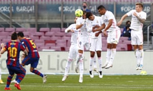 Lionel Messi sends a free-kick into the wall.