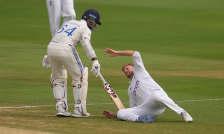England's Joe Root falls after colliding with India's Yashasvi Jaiswal on Sunday.