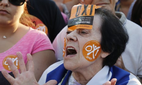 A demonstrator wears ‘oxi’ (no) stickers during an anti-austerity rally in Athens.