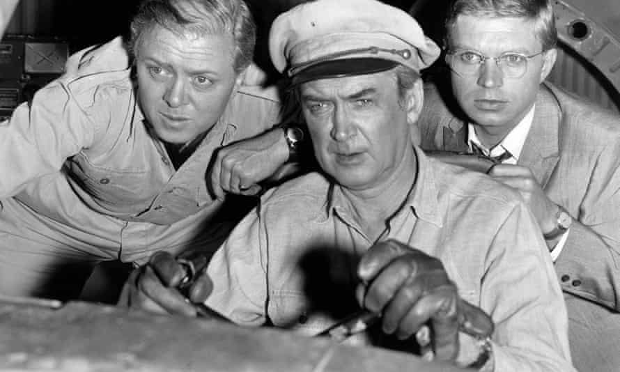 Hardy Krüger, right, with Richard Attenborough, left, and James Stewart in The Flight of the Phoenix, 1965.