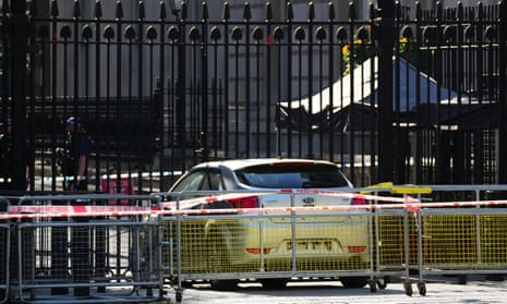 A car is seen after crashing into the the gates of Downing Street.