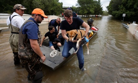 Residents flee from the rising waters after Hurricane Harvey.