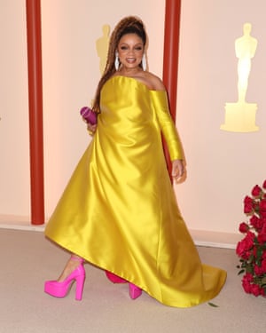 Ruth Carter who became the first black woman to win two Oscars, picked up her latest statuette in a canary yellow gown with a pink underlay and equally bright heels from Valentino. She laser-printed her earrings herself from an antique design