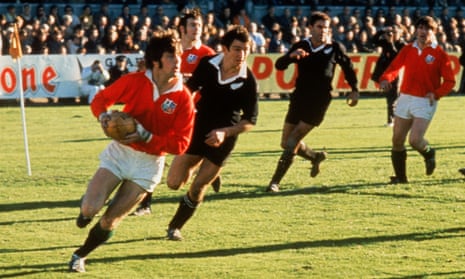 Barry John is pursued by Tane Norton of New Zealand during the Lions’ 9-3 victory in the first Test against the All Blacks in Dunedin in June 1971.
